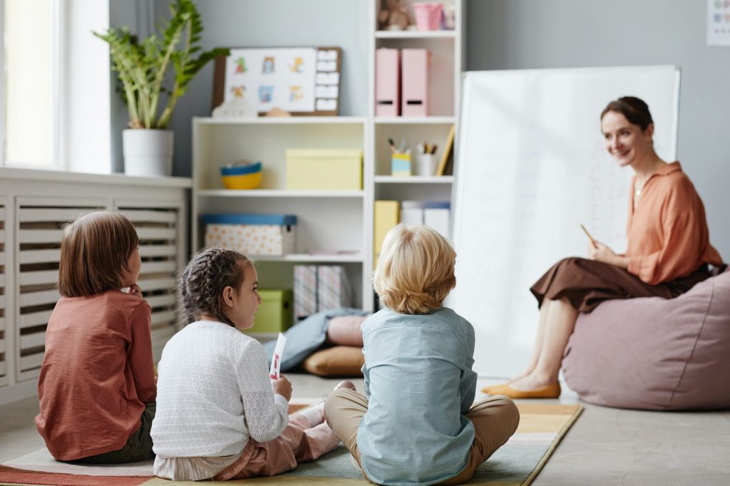 Children listening to the teacher at lesson