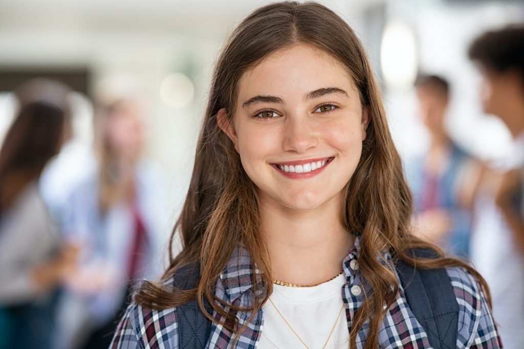 Happy student girl at high school